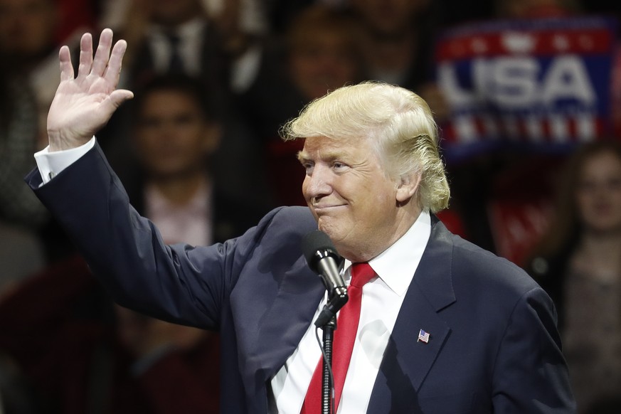 President-elect Donald Trump waves and smiles as he speaks during the first stop of his post-election tour, Thursday, Dec. 1, 2016, in Cincinnati. (AP Photo/John Minchillo)