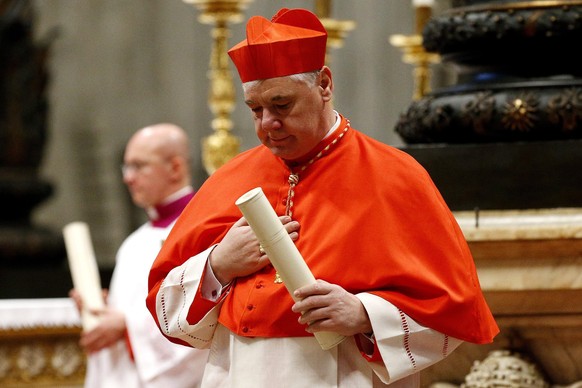 epa04095878 Newly-elevated Cardinal Gerhard Ludwig Mueller of Germany after having taken the oath as cardinal to Pope Francis (not pictured), during the consistory in St. Peter&#039;s Basilica, Vatica ...