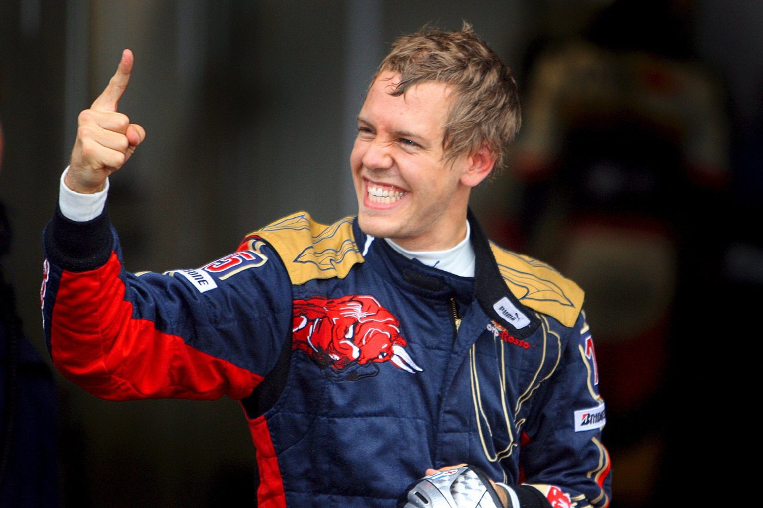 epa01486745 German Formula One driver Sebastian Vettel of the Toro Rosso reacts after he clocked the fastest time in the Qualifying session at the Italian Formula One circuit in Monza, 13 September 20 ...