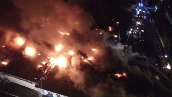 A still image, taken from video footage and released by the Russian Emergencies Ministry on September 23, 2016, shows a warehouse containing plastic materials on fire in Moscow, Russia. The Ministry o ...