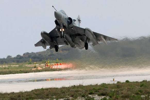 epa02669964 A French Mirage fighter takes off on a mission to Libya from the Souda military base on Crete Island, Greece, 04 April 2011. NATO conducted 70 air raids over Libya on 02 April, the Western ...