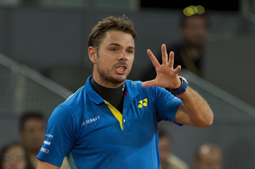 Stan Wawrinka of Switzerland gestures during a Madrid Open tennis tournament match against Benoit Paire of France in Madrid, Spain, Wednesday, May 10, 2017. (AP Photo/Paul White)