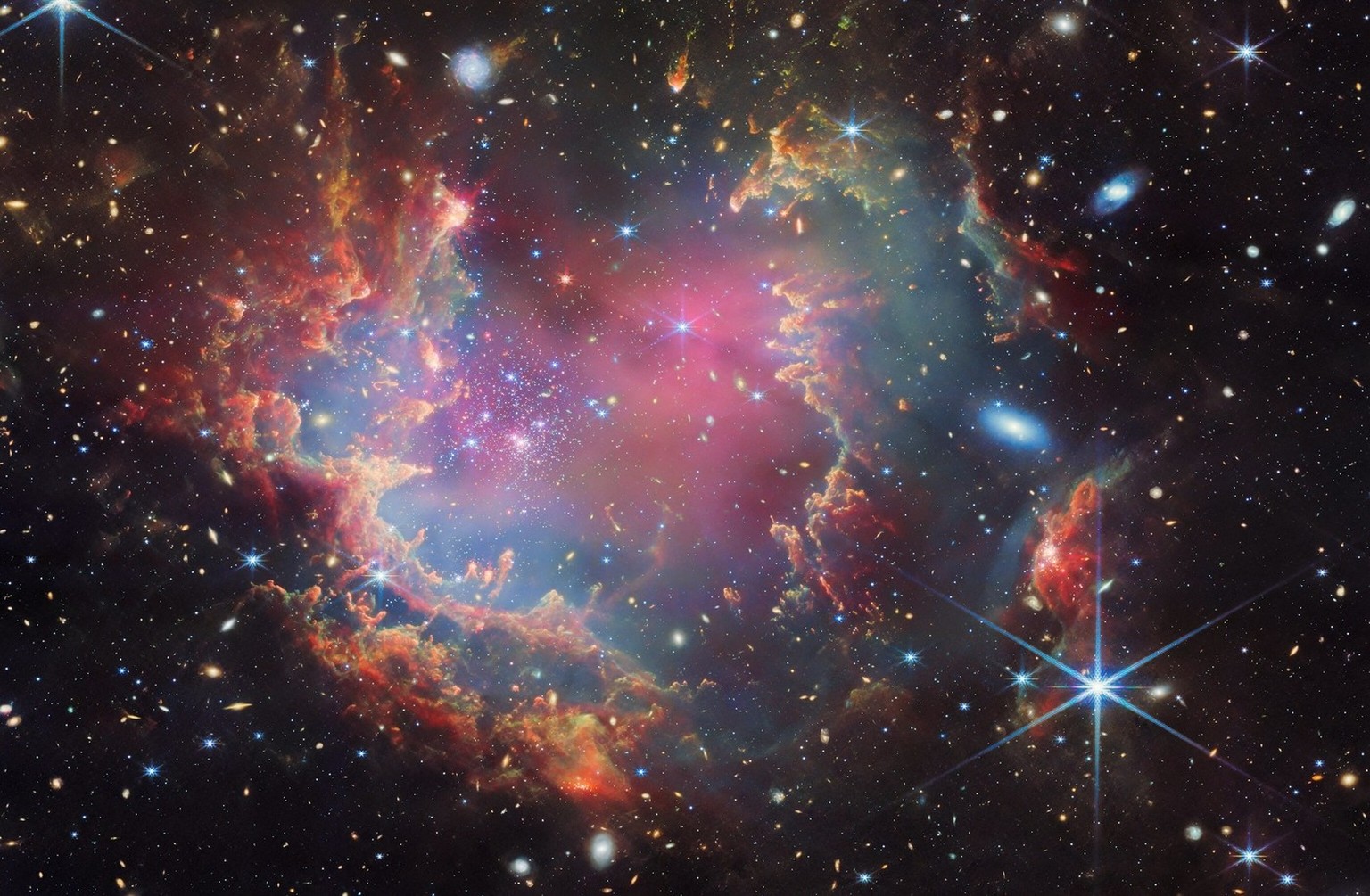 Nachrichten Linkding Das ist NGC 602, ein junger Sternhaufen in der Kleinen Magellanschen Wolke (eine unserer Satellitengalaxien), in dem Astronomen Kandidaten für die ersten Braunen Zwerge ausserhalb unserer Galaxie gefu ...