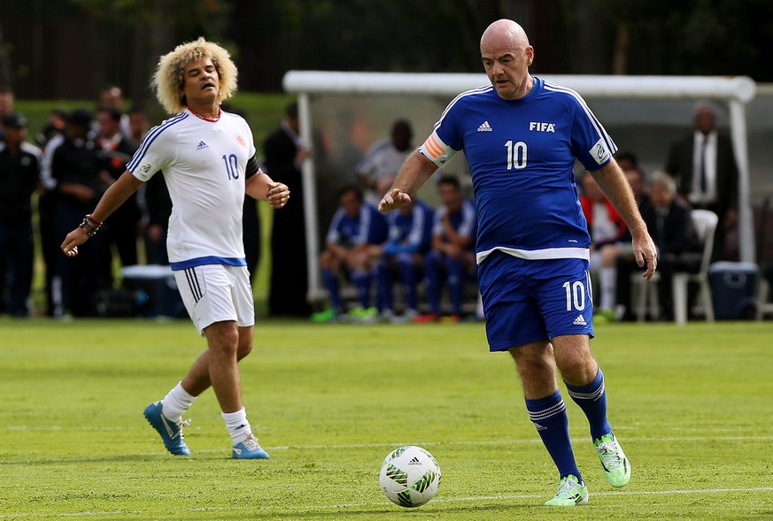 epa05568835 President of FIFA Gianni Infantino (R) of Fifa Legends in action against Carlos &quot;El Pibe&quot; Valderrama (L) of FCF Legends during a soccer match between FIFA Legends and FCF Legends ...