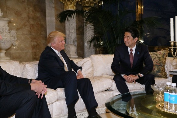 Japan&#039;s Prime Minister Shinzo Abe (R) meets with U.S. President-elect Donald Trump at Trump Tower in Manhattan, New York, U.S., November 17, 2016. Cabinet Public Relations Office/HANDOUT via Reut ...