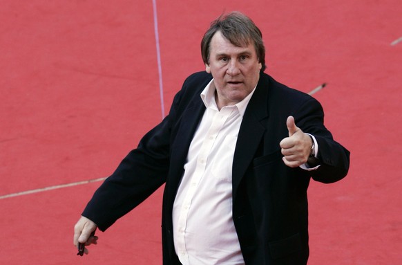 FILE - In this Sunday, Oct. 21, 2007 file photo, French actor Gerard Depardieu poses for photographers on the red carpet of the Rome Film Festival. Gerard Depardieu was in Cannes on Saturday, May 18,  ...