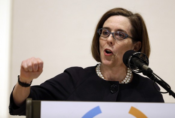 FILE- In this April 17, 2015, file photo, Oregon Gov. Kate Brown speaks during her State of the State address in Portland, Ore. Brown announced Thursday, Sept. 15, 2016, the settlement of lawsuits the ...