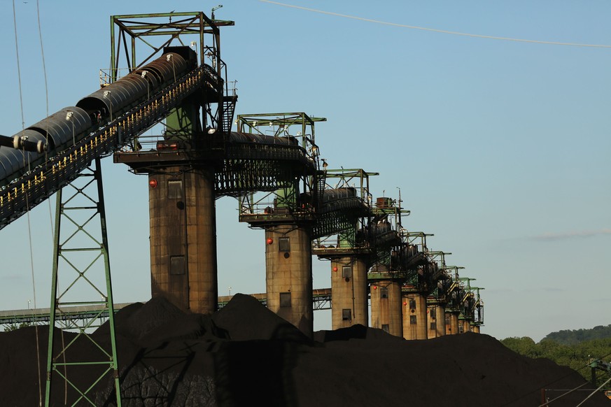 Coal is stacked at the base of coal loaders along the Ohio River in Ceredo, West Virginia May 18, 2014. With coal production slowing due to stricter environmental controls, the availability of natural ...