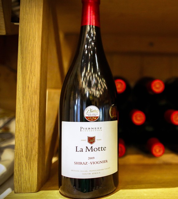 epa04897251 A view of a bottle of La Motte 2009 Shiraz Viognier from the Pierneef collection displayed at La Motte wine farm in Franschoek, South Africa, 25 August 2015. Situated in the beautiful Fran ...