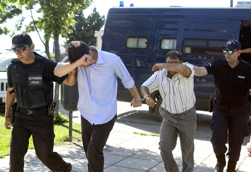 Turkish military personnel who were aboard a Blackhawk military helicopter are transferred to a prosecutor&#039;s office in the city of Alexandroupolis, northern Greece, Sunday July 17, 2016. A Blackh ...