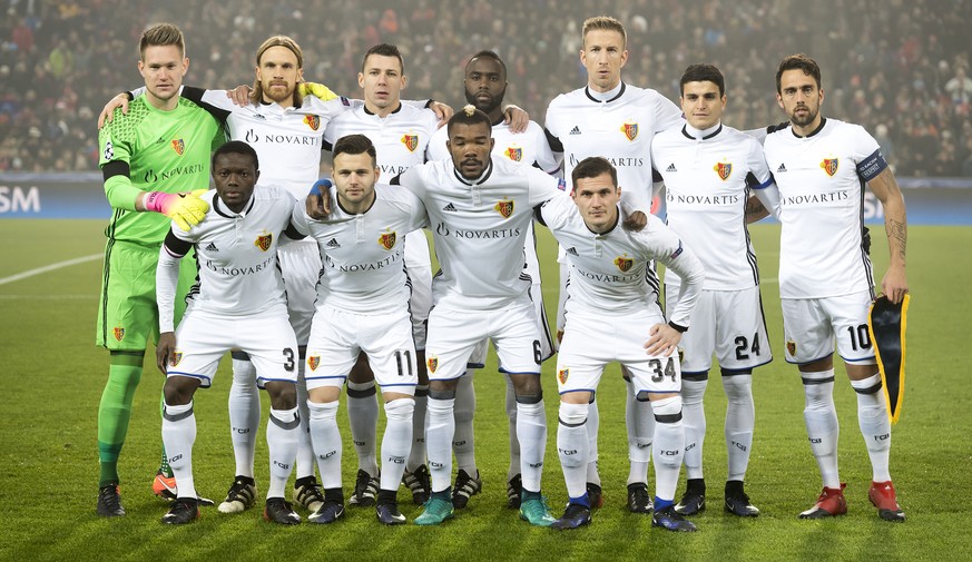 Basel&#039;s players pose prior to an UEFA Champions League Group stage Group A matchday 6 soccer match between Switzerland&#039;s FC Basel 1893 and England&#039;s Arsenal FC in the St. Jakob-Park sta ...