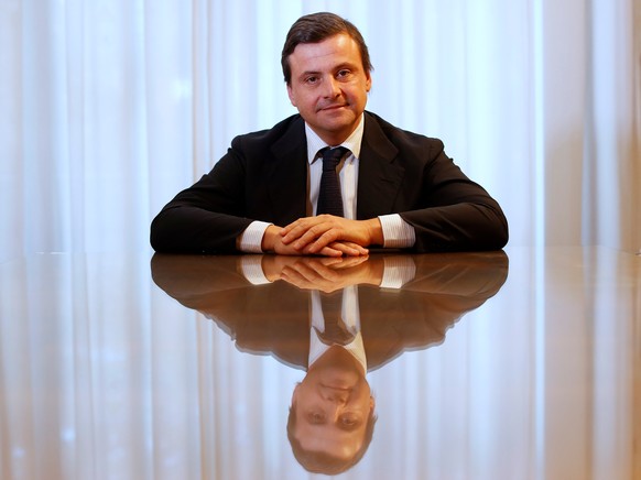 Italian Industry Minister Carlo Calenda poses during an interview with Reuters in his office in Rome, Italy November 25, 2016. REUTERS/Tony Gentile
