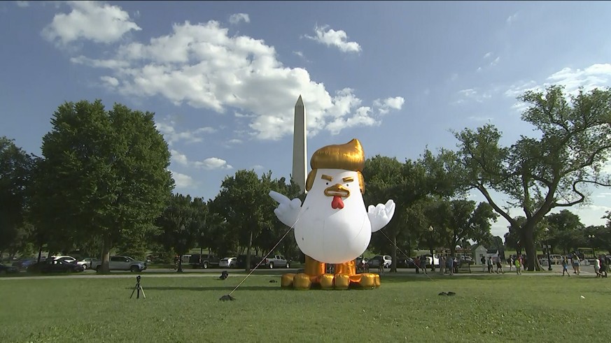 This image from video, shows a inflatable chicken on the Ellipse, just south of the White House in Washington, Wednesday, Aug. 9, 2017. The giant inflatable chicken bearing the unmistakable hairstyle  ...