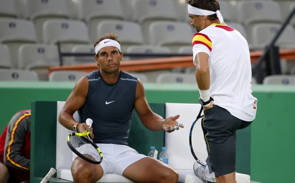 epa05452327 Rafael Nadal (L) and David Ferrer of Spain during a training session at the Olympic Tennis Center in Rio de Janeiro, Brazil, 02 August 2016. The Rio 2016 Olympic Games take place from 05 t ...