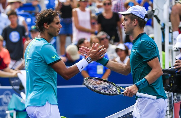 epa05497179 Borna Coric of Croatia (R) and Rafael Nadal of Spain (L) shake hands after the third seeded Nadal lost to Coric during their match in the Western &amp; Southern Open tennis championships a ...