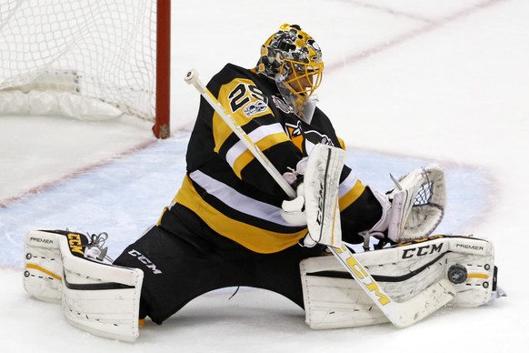 Pittsburgh Penguins goalie Marc-Andre Fleury makes save during the third period of Game 1 of the Eastern Conference final in the NHL Stanley Cup hockey playoffs against the Ottawa Senators in Pittsbur ...