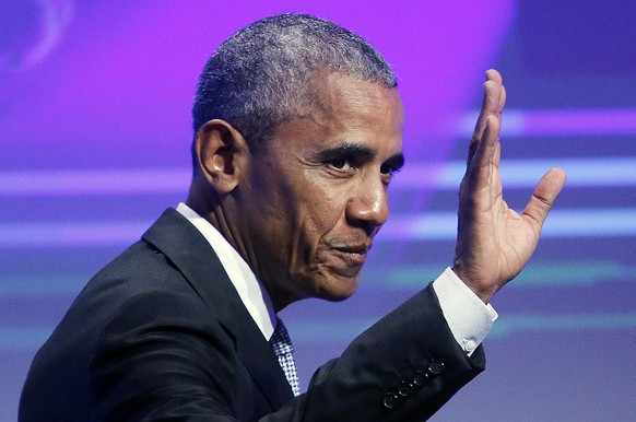 File-This May 25, 2017, file photo shows former US President Barack Obama waving before he is awarded the German Media Prize 2016 in Baden-Baden, Germany. Obama shocked students at a Washington school ...