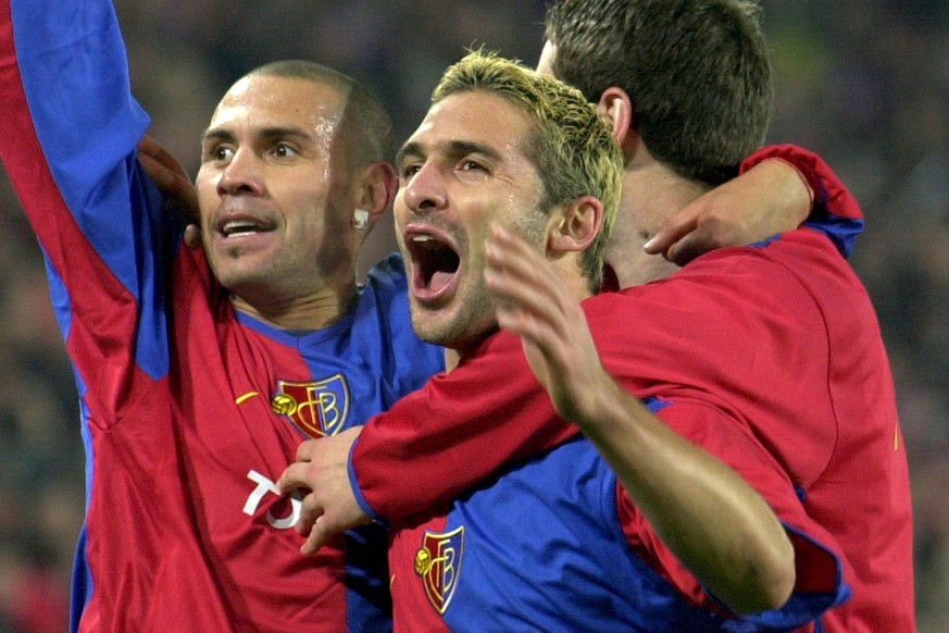 Basel&#039;s Christian Gimenez, left, reacts after he scores the second goal, with his teammates Julio Rossi, center, who scores first at the Champions League, Group B, soccer game Basel vs Liverpool  ...