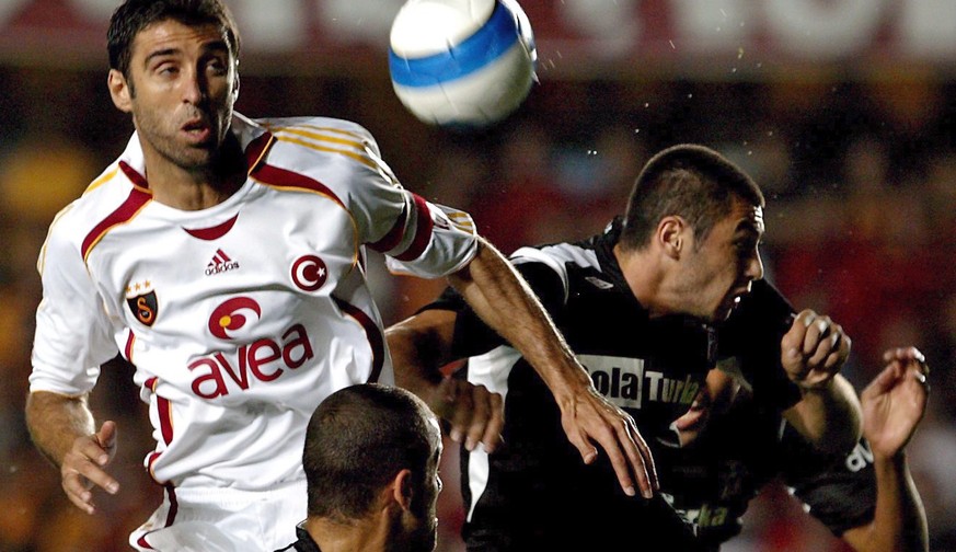 epa05178638 (FILE) A file picture dated 17 September 2006 of Galatasaray&#039;s Hakan Sukur (L) fighting for ball against Besiktas&#039; Burak Yilmaz (R) during their Super League soccer match at Ali  ...