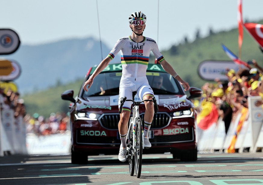 epa12243270 Slovenian rider Tadej Pogacar of UAE Team Emirates celebrates winning the 12th stage of the Tour de France cycling race over 180.6km from Auch to Hautacam, France, 17 July 2025. EPA/CHRIST ...