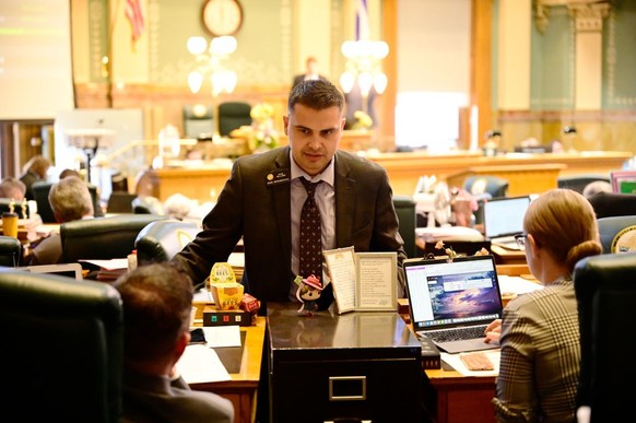 DENVER, CO - MAY 10 : Rep. Dave Williams, center, is talking with Rep. Patrick Neville, left, and Rep. Stephanie Luck, right, at Colorado State House Chamber in Denver, Colorado on Tuesday, May 10, 20 ...