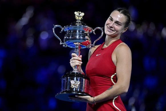 epa11107783 Aryna Sabalenka of Belarus poses with the Daphne Akhurst Memorial Trophy following her Women&#039;s Singles Final win over Qinwen Zheng of China on Day 14 of the Australian Open tennis tou ...