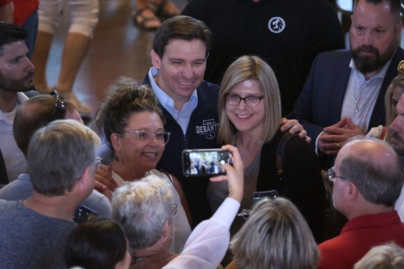 PELLA, IOWA - MAY 31: Republican presidential candidate Florida Governor Ron DeSantis greets guests following a campaign event on May 31, 2023 in Pella, Iowa. The event is one of five campaign events  ...