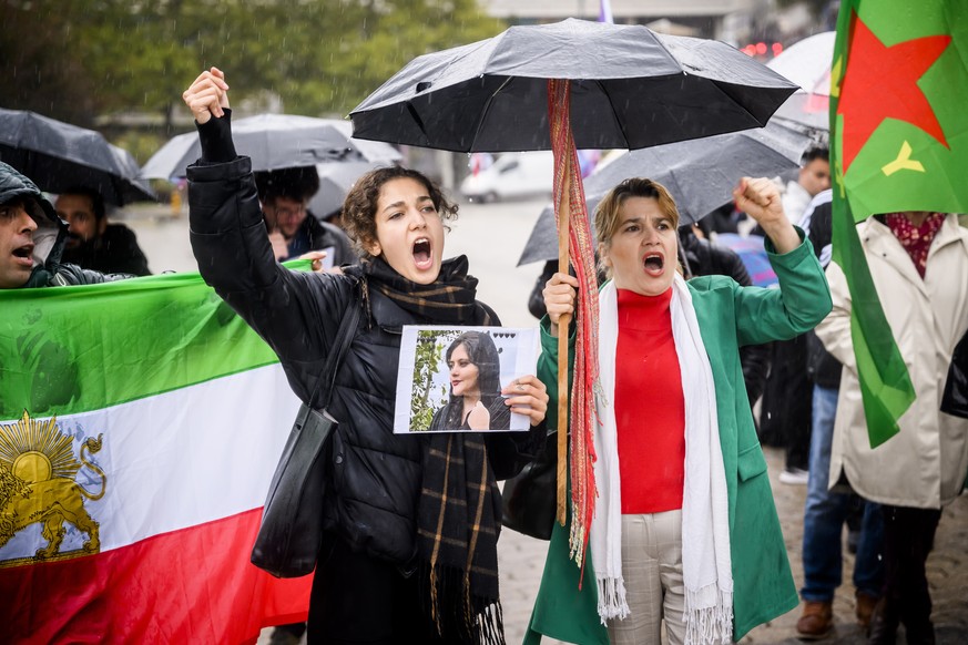epa10211828 People take part in a protest against the death of Iranian Mahsa Amini, in Lausanne, Switzerland, 28 September 2022. 22-year-old Amini was arrested in Tehran on 13 September by the moralit ...