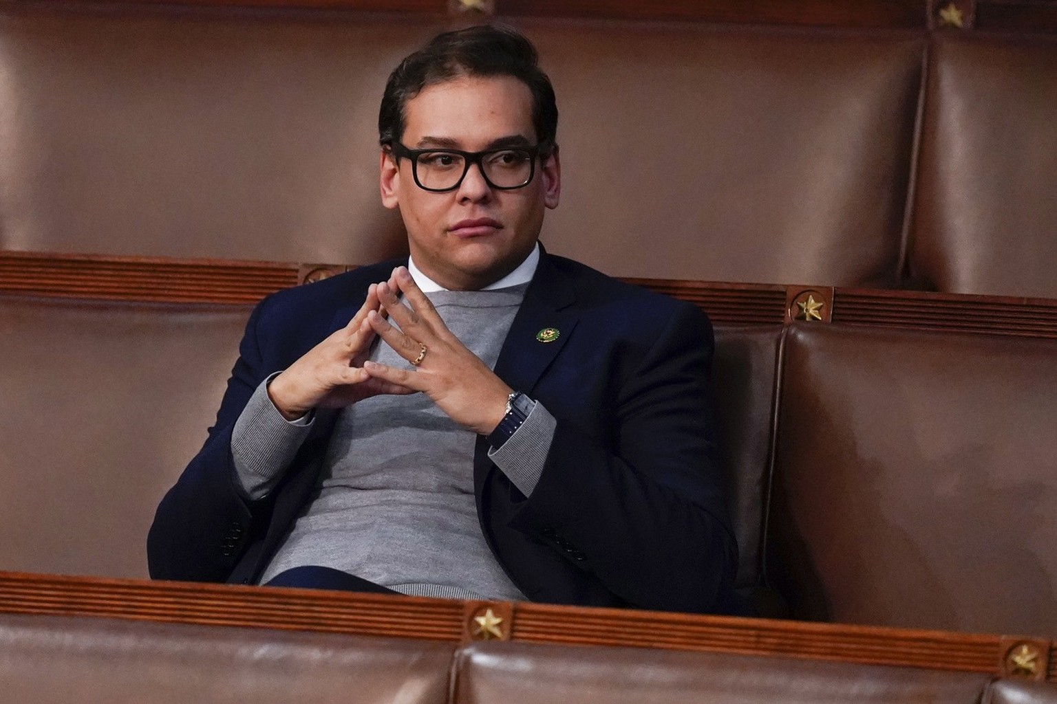 Rep. George Santos, R-N.Y., waits for the start of a session in the House chamber as the House meets for the fourth day to elect a speaker and convene the 118th Congress in Washington, Friday, Jan. 6, ...