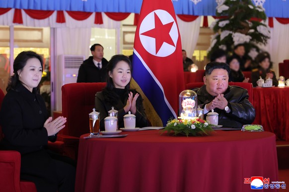 epa12620132 A photo released by the official North Korean Central News Agency (KCNA) shows North Korean leader Kim Jong Un (R), his daughter Kim Ju Ae (C) and wife Ri Sol-ju clapping during an art per ...