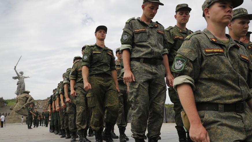 FILE - Russian army soldiers march during an action in support for the soldiers involved in the military operation in Ukraine, at the Mamaev Kurgan, a World War II memorial in Volgograd, Russia, July ...
