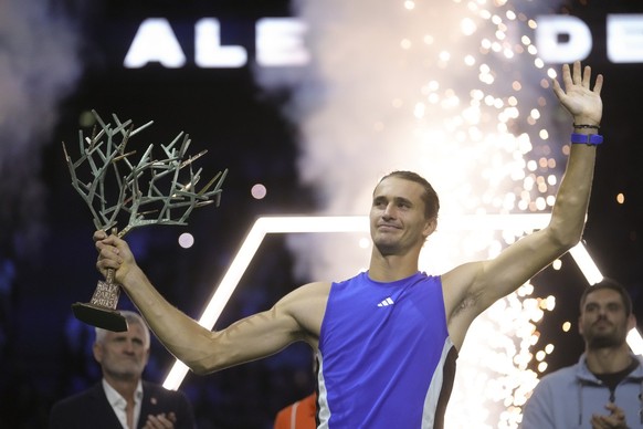 Germany&#039;s Alexander Zverev lifts the trophy after winning the final of the Paris Masters tennis tournament at the Accor Arena on Sunday, Nov. 3, 2024, in Paris. (AP Photo/Thibault Camus)