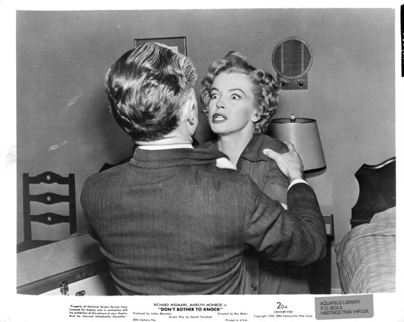Richard Widmark holds onto a crazed Marilyn Monroe in a scene from the film 'Don't Bother To Knock', 1952. (Photo by 20th Century-Fox/Getty Images)