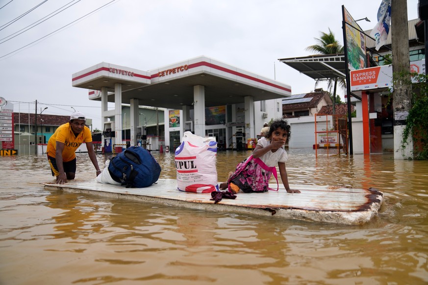 A man uses a makeshift raft to navigate a flooded street in Colombo, Sri Lanka, Saturday, Nov. 29, 2025. (AP Photo/Eranga Jayawardena)
Sri Lanka Extreme Weather