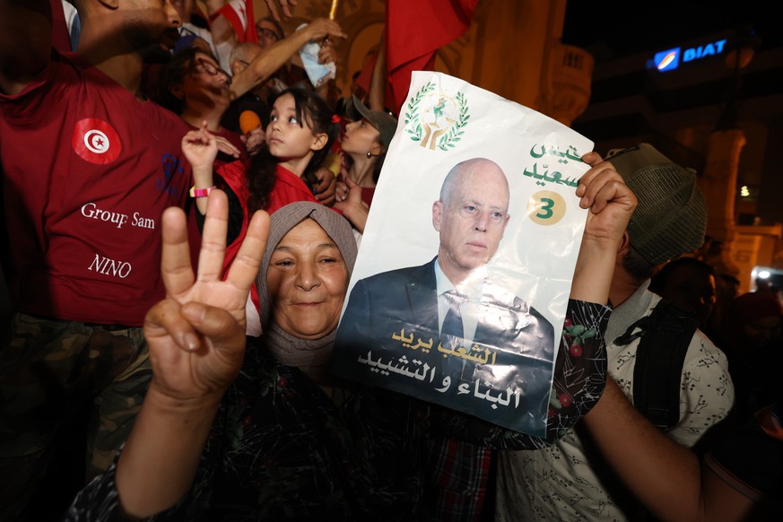 epa11646350 Supporters of Tunisian presidential candidate Kais Saied celebrate after unofficial results of the Tunisian presidential election in the capital Tunis, Tunisia, 06 October 2024. Tunisia&#0 ...