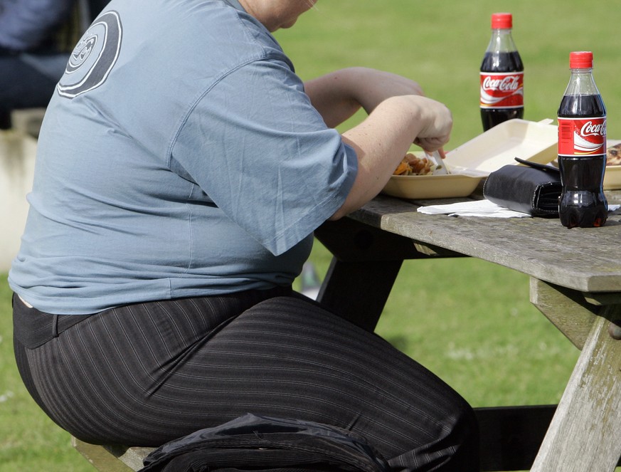 FILE - A person eats in London on Oct. 17, 2007. The World Health Organization says the number of heavy people in Europe has hit Äúepidemic proportions,Äù with nearly 60% of adults and one third of  ...