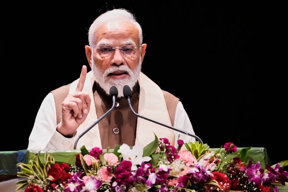 Indian Prime Minister Narendra Modi speaks during a ceremony to distribute land titles known as "pattas" in Guwahati, India, Friday, March 13, 2026. (AP Photo/Anupam Nath)
India Modi Land Ti ...