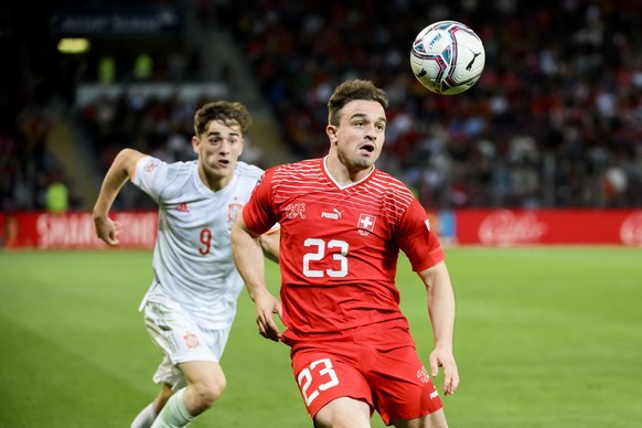 Spain&#039;s midfielder Gavi, left, fights for the ball with Switzerland&#039;s midfielder Xherdan Shaqiri, right, during the UEFA Nations League group A2 soccer match between Switzerland and Spain at ...