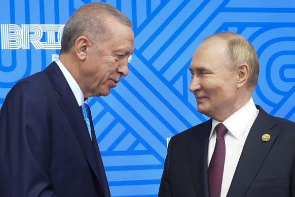 Russian President Vladimir Putin, right, meets with Turkish President Recep Tayyip Erdogan on the sidelines of the BRICS summit in Kazan, Russia, Wednesday, Oct. 23, 2024. (AP Photo/Alexander Zemliani ...