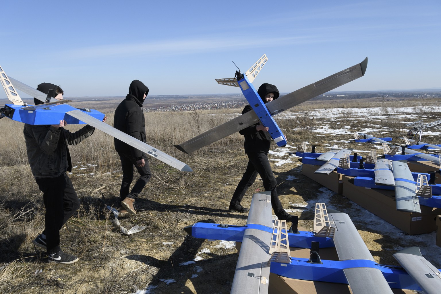 epa11913346 Ukrainian developers handle Besomar 3210 unmanned aerial vehicle (UAV) systems during their handover to the Ukrainian army at an undisclosed location in the Lviv region, western Ukraine, 2 ...