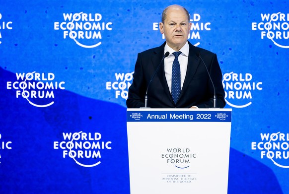 epa09976596 German Chancellor Olaf Scholz addresses a plenary session during the 51st annual meeting of the World Economic Forum (WEF) in Davos, Switzerland, 26 May 2022. The meeting brings together e ...