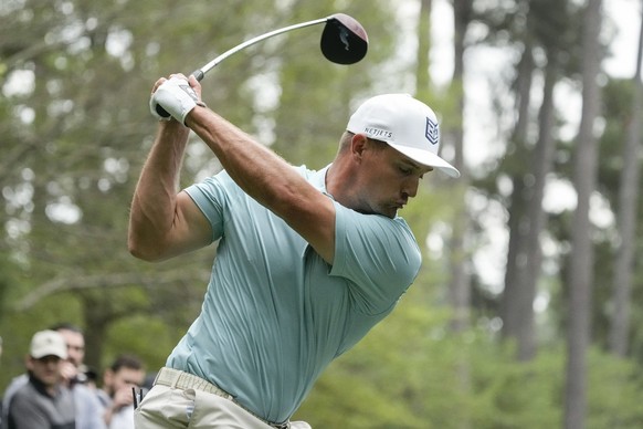 Bryson DeChambeau hits from the seventh tee during a practice for the Masters golf tournament at Augusta National Golf Club, Monday, April 3, 2023, in Augusta, Ga. (AP Photo/Charlie Riedel)