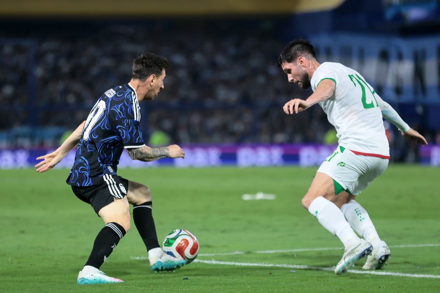 epa12855715 Lionel Messi (L) of Argentina vies for the ball with Jordan Lefort of Mauritania during the international friendly match between Argentina and Mauritania in Buenos Aires, Argentina, 27 Mar ...