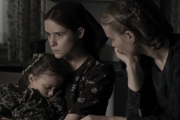 This image released by United Artists shows Emily Mitchell, from left, Claire Foy and Rooney Mara in a scene from &quot;Women Talking.&quot; (Michael Gibson/Orion - United Artists Releasing via AP)