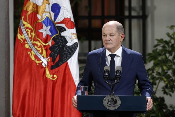 epa10439422 German Chancellor Olaf Scholz attends a joint statement with Chilean President Gabriel Boric (not pictured) at La Moneda palace, in Santiago, Chile, 29 January 2023. Scholz began his first ...