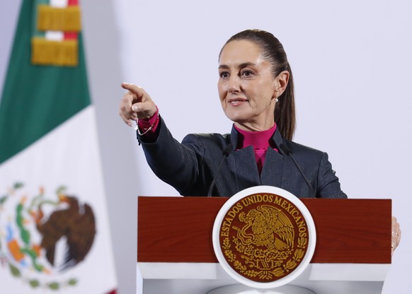 epa11735128 Mexican President Claudia Sheinbaum gestures during a press conference at the National Palace in Mexico City, Mexico, 22 November 2024. Sheinbaum addressed the volume of imports from China ...
