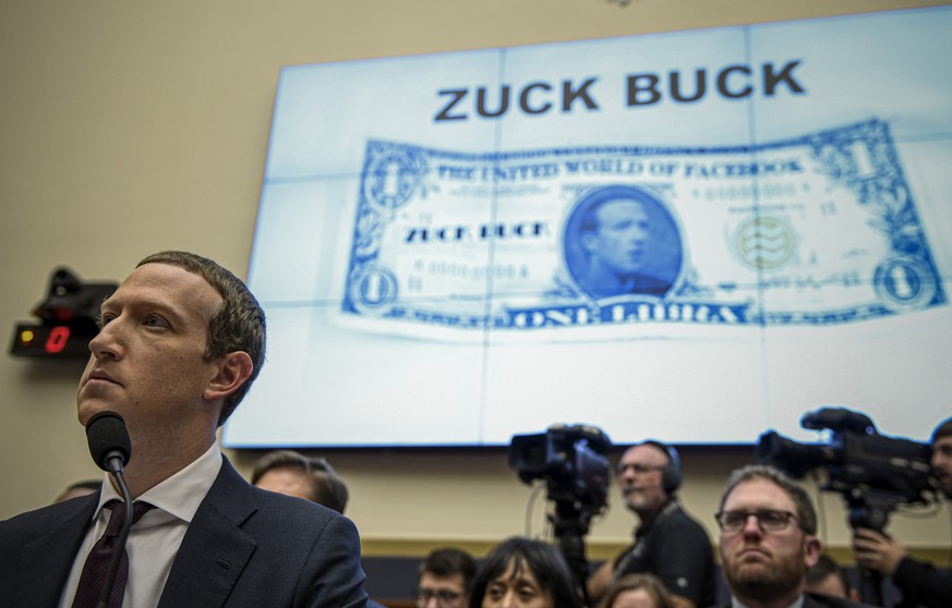 FILE - Facebook Chief Executive Officer Mark Zuckerberg, left, testifies before the House Financial Services Committee on Capitol Hill in Washington, about his plans for the new cryptocurrency Libra,  ...