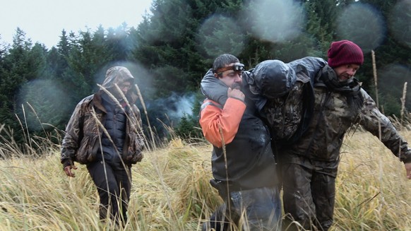 Outlast. (L to R) Nick Radner, Angie Esparza and Seth Lueker in Episode 1 of Outlast. Cr. Courtesy of Netflix © 2023