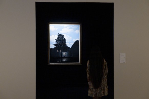 epa11710287 The painting &#039;L&#039;Empire des lumieres&#039; by Belgian artist Rene Magritte on display as part of a preview of upcoming auctions at Christie&#039;s in New York, New York, USA, 08 N ...