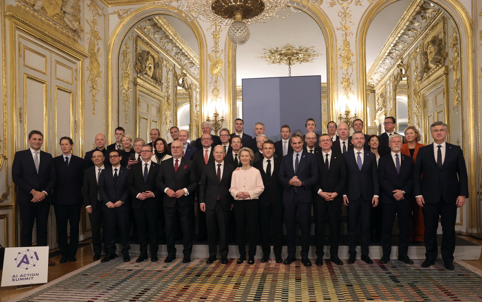 epaselect epa11886936 French President Emmanuel Macron (C) and European leaders pose for a family picture during a meeting as part of the Artificial Intelligence (AI) Action Summit at the Elysee in Pa ...